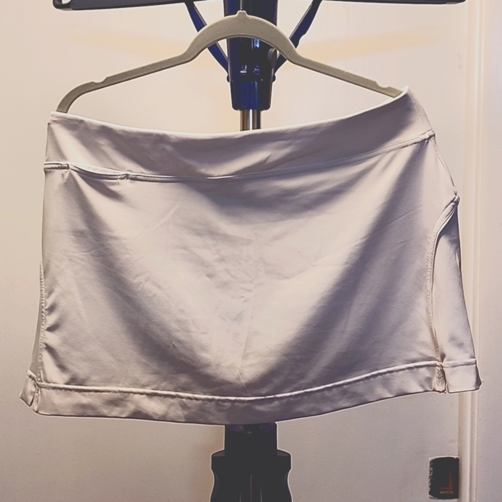 White tennis skirt with inner shorts and a key pocket